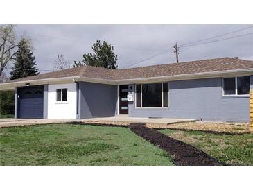 Charming single-story home with a mix of brick and painted finishes and updated landscaping at 951 E 10Th Ave, Broomfield, CO 80020