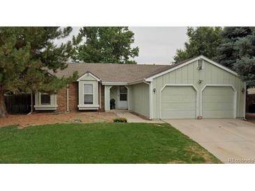 Charming single-story home with a two-car garage and well-maintained front yard at 19383 E Chaffee Pl, Denver, CO 80249