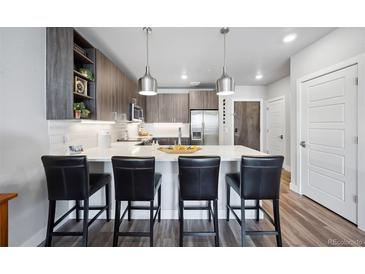 Modern kitchen with stainless steel appliances and an island at 20 Wilcox St # 314, Castle Rock, CO 80104