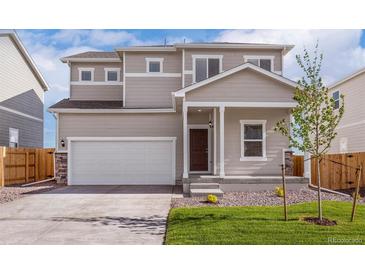 Beautiful two-story home with a two car garage and professional landscaping at 48260 Shetland Dr, Bennett, CO 80102