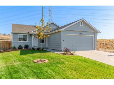 Ranch style home with attached garage and landscaped lawn at 11082 Callaway Rd, Parker, CO 80138