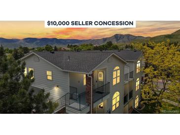 Inviting condo boasts mountain views, seller concession, covered balconies, and steps to entry, nestled near trees at 1670 S Deframe St # C2, Lakewood, CO 80228