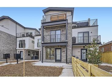 Modern townhouse with multi-level balconies and stone facade at 1462 Yates St, Denver, CO 80204