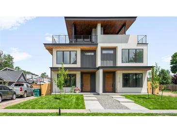 Modern townhome showcases a roof deck, stylish facade, and well-manicured lawn at 2926 S Cherokee St, Englewood, CO 80110