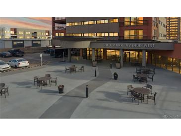 A modern building exterior with outdoor seating and parking, perfect for enjoying the city view at 100 Park W Ave # 1806, Denver, CO 80205
