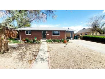 Charming brick home with a well-maintained front yard and sidewalk, offering a welcoming curb appeal at 7620 Hooker St, Westminster, CO 80030