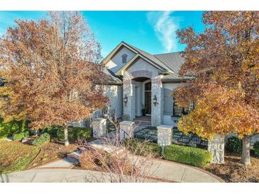 Luxury home with stone accents and landscaping, offering curb appeal at 5960 S Watson Ln, Littleton, CO 80123
