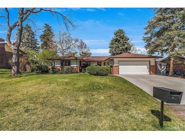 Charming ranch-style home with well-manicured lawn and mature trees in a peaceful neighborhood at 2575 Quail St, Lakewood, CO 80215