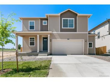 Charming two-story home featuring a two-car garage and covered front porch, great curb appeal at 4312 Gypsum Ave, Mead, CO 80504