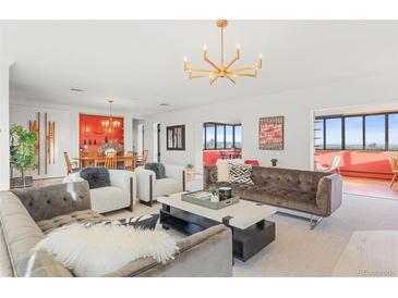 Bright, open living room featuring modern furnishings, stylish decor, and city views at 3131 E Alameda Ave # 2102, Denver, CO 80209