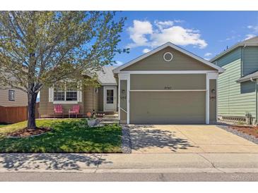 Charming single-story home with a well-maintained lawn and a two-car garage at 3787 Bucknell Dr, Highlands Ranch, CO 80129