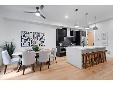 Open-concept kitchen and dining area featuring modern finishes and stainless steel appliances at 2010 Pearl St # B, Boulder, CO 80302