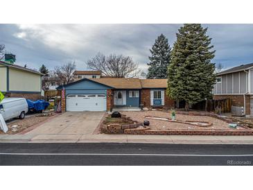 Charming single-story home with a well-maintained front yard and an attached two-car garage at 11397 Kendall St, Westminster, CO 80020