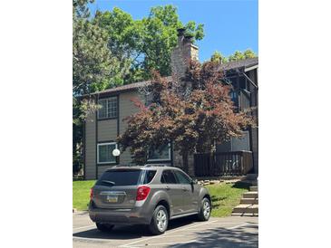 Charming condo featuring a stone chimney and a parking spot, perfect for easy access at 1850 S Pitkin Cir # B, Aurora, CO 80017