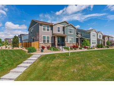 Charming two-story home with a landscaped front yard and inviting curb appeal at 11330 Pacific Peak Ct, Parker, CO 80134