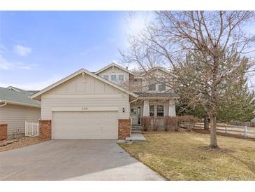 Charming two-story home featuring a two-car garage and inviting facade in a serene neighborhood at 2573 S Troy Ct, Aurora, CO 80014