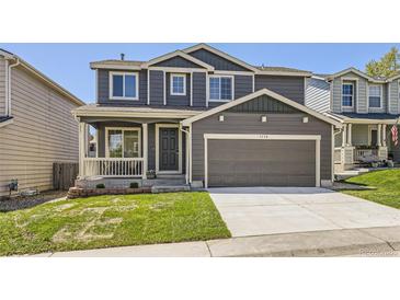 Charming two-story home featuring a covered porch and a two-car garage at 1138 W 84Th Pl, Denver, CO 80260