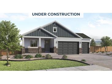 Charming home featuring a neutral palette, stone accents, a pristine lawn and a three car garage at 414 Clear Bell Ln, Monument, CO 80132