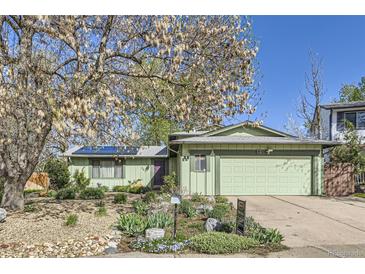 Charming single-Gathering home featuring a well-maintained lawn and a two-car garage at 547 S Flower St, Lakewood, CO 80226