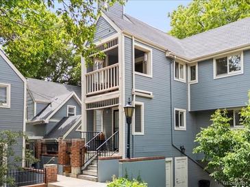 Charming townhouse with a private balcony, classic lamppost and landscaped entrance at 101 S Downing St # 8, Denver, CO 80209