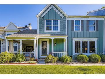 Charming two-story home with a covered porch and beautifully landscaped front yard at 19725 Rosewood Ct, Parker, CO 80138