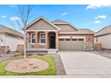 Charming single-Gathering home with a two-car garage and inviting front porch at 8552 W San Juan Ave, Littleton, CO 80128