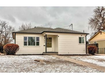 Charming single-story home with a well-maintained front yard and sidewalk at 808 Hanover St, Aurora, CO 80010