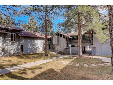 Inviting exterior of a multi-Gathering home surrounded by mature trees and manicured lawns at 2378 Hearth Dr # 6, Evergreen, CO 80439