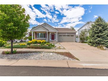Charming single-Gathering home featuring a well-manicured lawn and two-car garage at 5403 Odessa St, Denver, CO 80249
