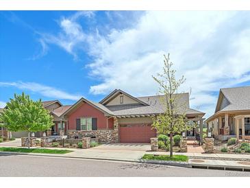 Charming single-Gathering home with a two-car garage, stone accents, and well-kept landscaping at 1130 Summit View Dr, Louisville, CO 80027