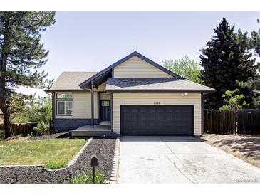 Charming home featuring a well-maintained front yard and attached two-car garage in a lovely community at 3328 S Danube St, Aurora, CO 80013