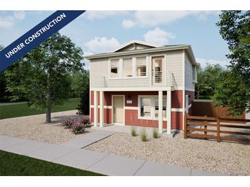 Two-story red home with balcony, under construction, in a new development at 13546 E 103Rd Pl, Commerce City, CO 80022