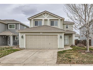 Charming two-story home with a two-car garage and well-maintained lawn at 20785 E 39Th Ave, Denver, CO 80249