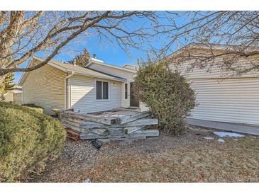 Ranch style home with a well-maintained yard and attached garage at 246 S 22Nd Ave, Brighton, CO 80601