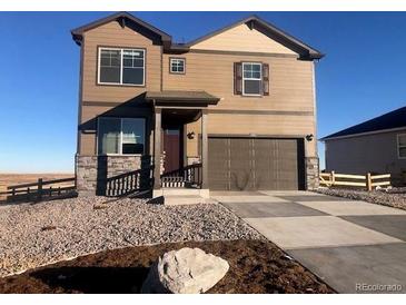 Two-story house with stone accents and a large driveway at 3319 Belleville Ridge Rd, Elizabeth, CO 80107