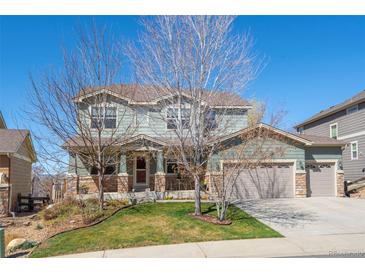 Charming two-story home boasts a two-car garage, well-kept lawn, and inviting curb appeal at 16823 Weber Way, Mead, CO 80542
