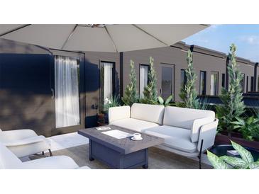 Inviting patio featuring stylish seating, modern design, and lush greenery, perfect for relaxation and outdoor enjoyment at 115 W 2Nd Ave # 104, Denver, CO 80223