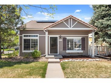 Charming single-Gathering home features a well-maintained lawn, inviting facade, and appealing landscaping at 4713 Perth St, Denver, CO 80249