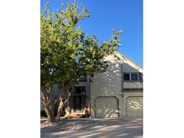 Traditional two-story home with a two-car garage and lush landscaping at 5479 E Weaver Ave, Centennial, CO 80121