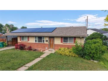 Charming single-story home featuring solar panels, well-maintained lawn, and inviting curb appeal at 41 S Fenton St, Lakewood, CO 80226