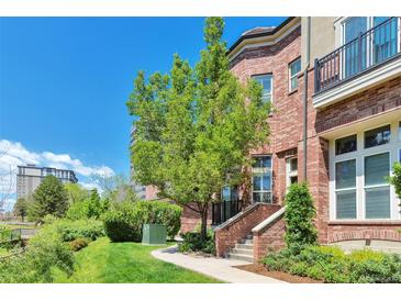 Beautiful brick townhome with landscaped front yard and inviting entrance in a desirable neighborhood at 5426 Dtc Pkwy, Greenwood Village, CO 80111