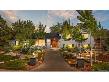 Charming two-story home with beautifully landscaped front yard and inviting entrance at 4218 S Alton St, Greenwood Village, CO 80111