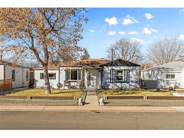 Charming single-story home with a welcoming front porch and well-maintained landscaping at 4389 S Sherman St, Englewood, CO 80113