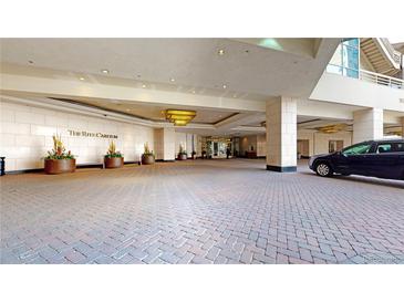 Elegant Ritz-Carlton entrance with brick paving and luxury hotel lobby access at 1891 Curtis St # 1613, Denver, CO 80202