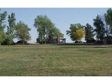 Charming home on a large lot, surrounded by mature trees and lush greenery, perfect for peaceful living at 6363 County Road 20, Longmont, CO 80504