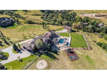 Luxury estate home with pool, expansive grounds, and detached garage at 10385 Grande Vista Ct, Lone Tree, CO 80124