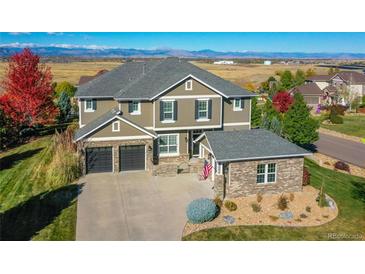 Two-story home with attached garage and mountain views at 14959 Wistera Way, Broomfield, CO 80023