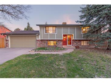 Charming two-story home with red brick and a well-maintained front yard at 12642 E Ohio Ave, Aurora, CO 80012