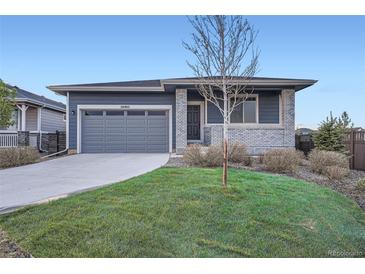 Charming home featuring a manicured front yard and a two-car garage at 26902 E Ellsworth Ave, Aurora, CO 80018