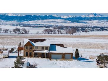 Stunning two-story home featuring a spacious two-car garage and picturesque mountain views at 10650 Yellowstone Rd, Longmont, CO 80504